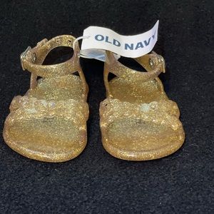 Gold baby jelly sandals. 0-3 M. Never worn.